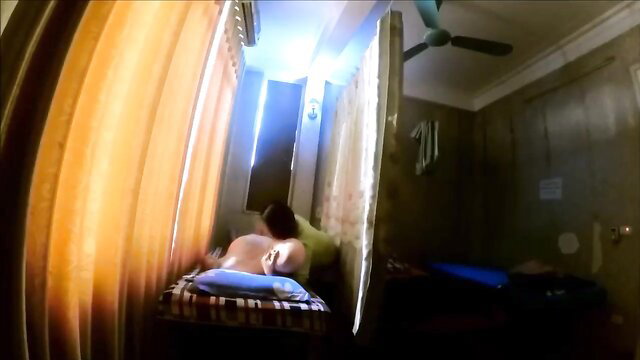 Nude Asian woman lying on massage bed in cheap parlor happy ending