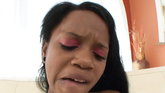 Closeup of sexy ebony MILF with pink eyeshadow, open mouth reaction