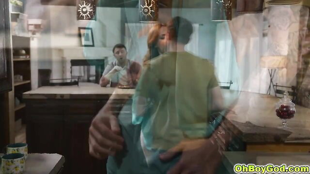 Siri Dahl embraced from behind by man in steamy kitchen scene