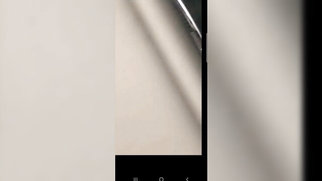 Blurry spy cam closeup of nude white woman's breasts and face