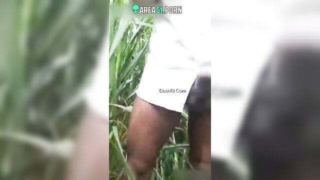 Desi wife cheating outdoor caught in grass, exposed thigh closeup