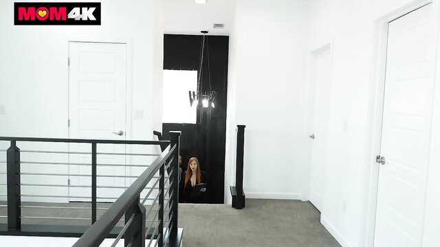 Lauren Phillips redhead MILF peeking from dark room in MOM4K