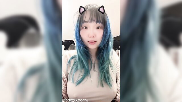 Harriet Sugarcookie in cat ears, teal hair, cleavage tease