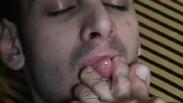 Man with goatee sucking own toe closeup in solo fetish video