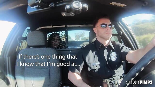 Police officer drives patrol car with black woman detainee in back seat