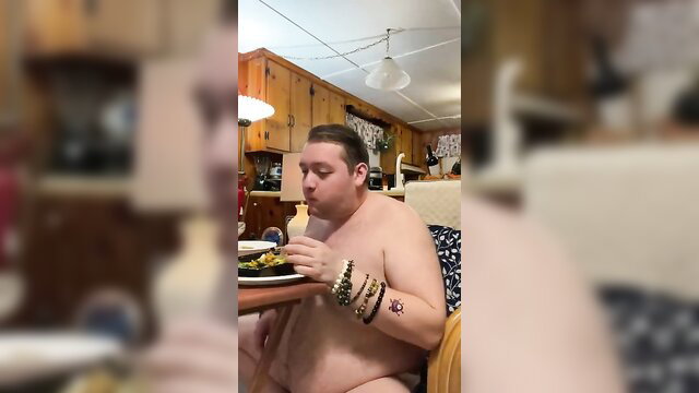Naked fat man eating shirtless in kitchen, obese feeder thumbnail