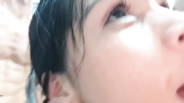 Closeup of attractive Asian MILF's face in steamy orgy video