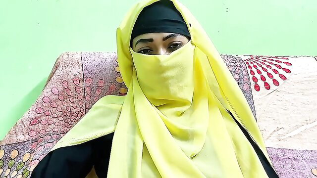 Veiled Arab hot wife in yellow niqab and hijab, seductive eyes