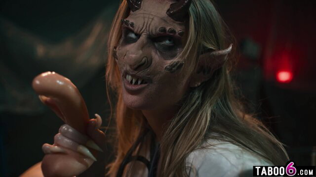 Blonde demon monster woman holds huge dildo, terrifying hybrid surgeon look