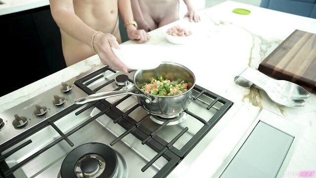 Nude Cory Chase and Rebel Rhyder cooking veggies in kitchen