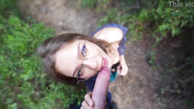 Glasses brunette babe sucks cock in risky public woods POV
