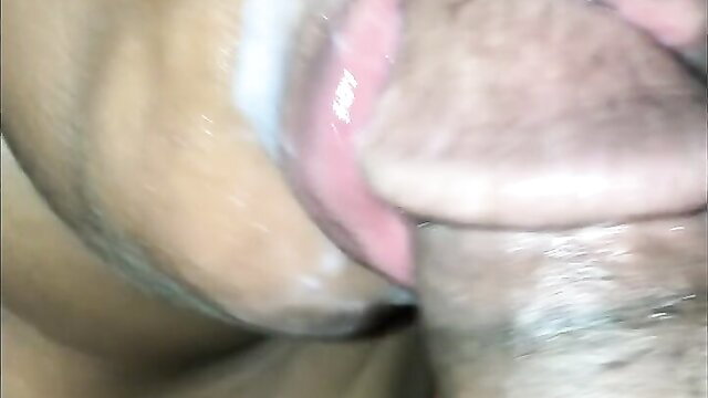 Closeup of woman passionately sucking cock with cum dripping from lips