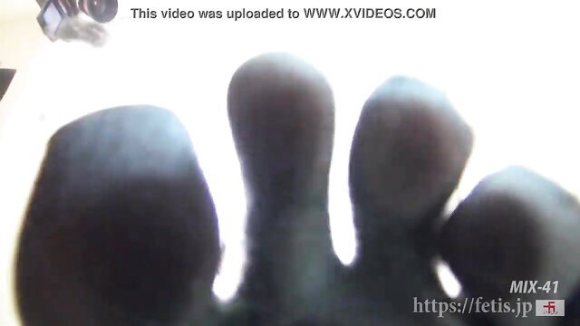 Extreme closeup of thick toes and foot in fetish thumbnail