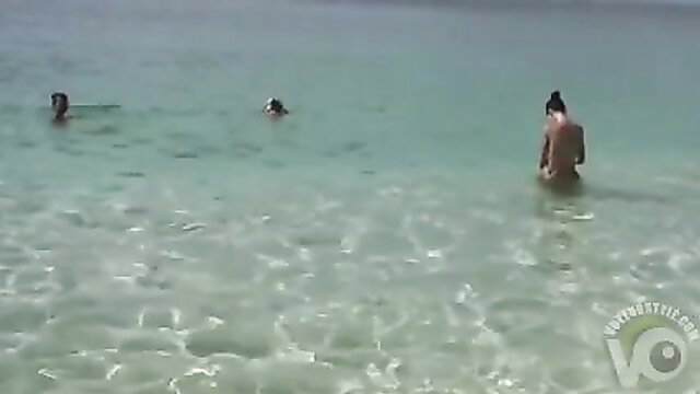 Nude Asian women skinny dipping naked in turquoise beach waters