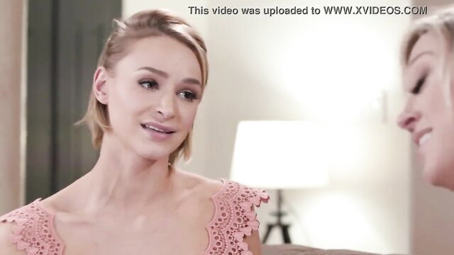 Two blonde women in an intimate setting