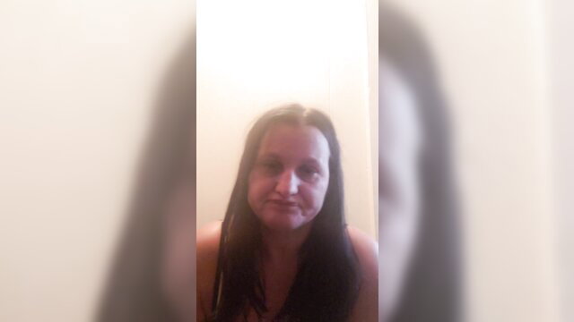 Amateur brunette with pale skin sucking huge dildo closeup