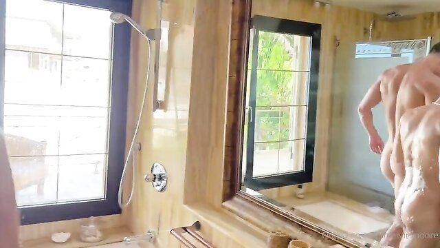 Muscular white guy soaping up shredded back and ass in steamy shower