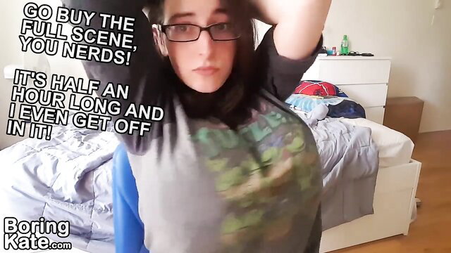 Nerdy busty girl in graphic tee promotes hour-long titty skittle breast expansion trailer