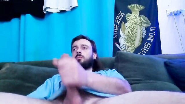 Man masturbating on a couch