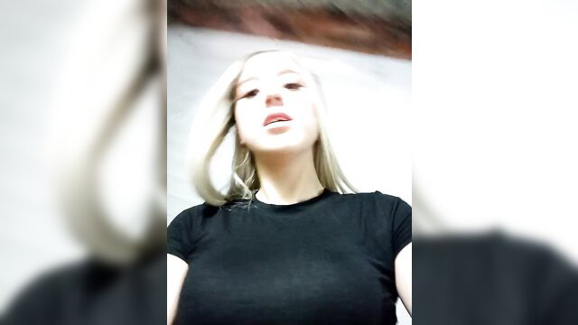 Eva-2023 blonde beauty in tight black top, teasing cleavage selfie