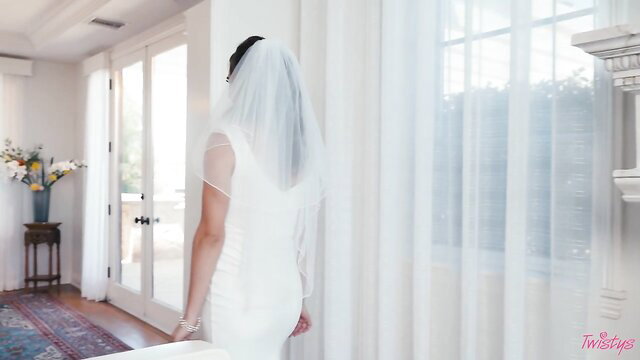 Katrina Colt as stunning runaway bride in sheer white wedding dress and veil
