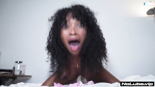 Barbie Rous ebony babe with huge tits tongue out closeup