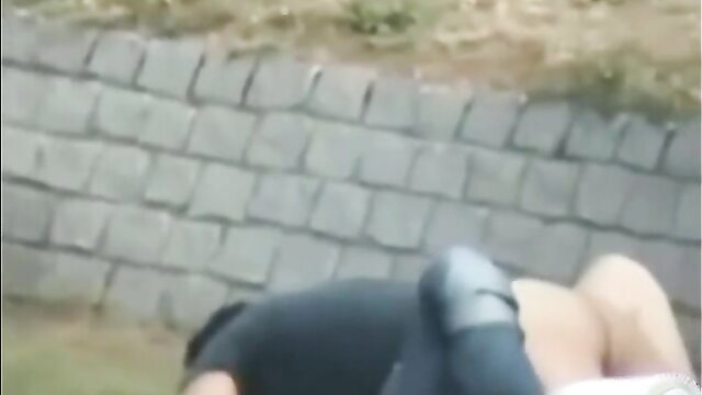 Young German couple fucking outdoors on grass, doggy style