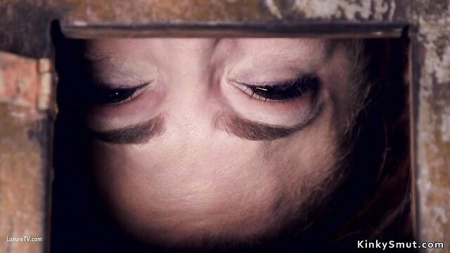 Closeup of gagged babe's eyes in device bondage vibrator torment