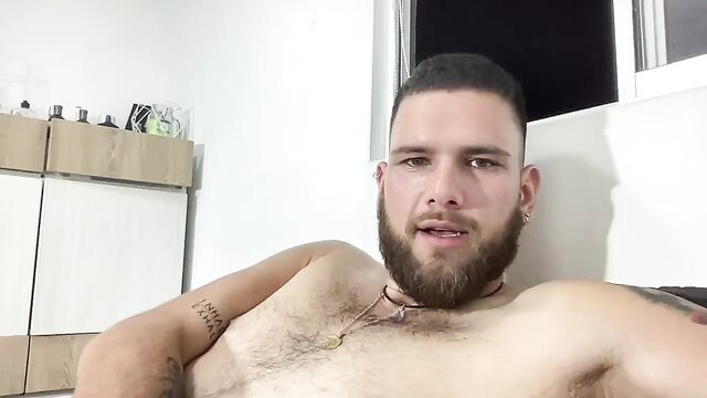 Bearded Latino hunk Caballero0314 shirtless flexing hairy chest tattoos