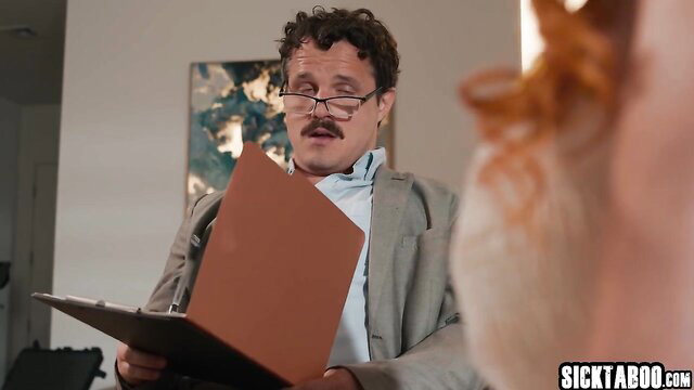 Lauren Phillips with red hair faces therapist in therapy session