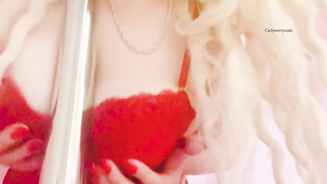 Blonde bombshell in red bra grabs tits, seductive stripper tease