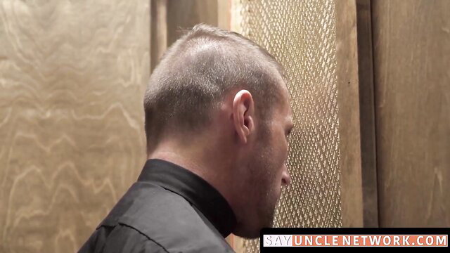 Bald priest in black collar faces gloryhole booth in Catholic assfucking vid