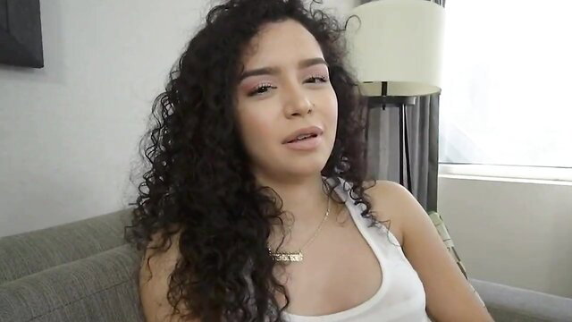 Curly-haired exotic latina stepsis in tank top, seductive gaze