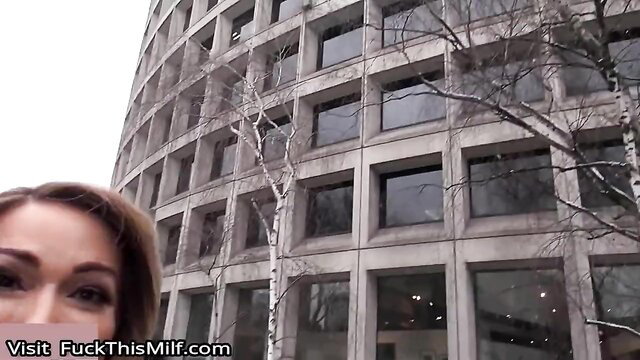 Stunning MILF Aubrey Black outside brutalist building