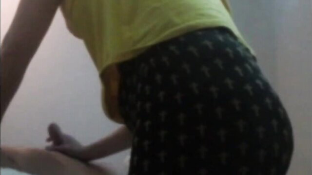 Asian woman in tight leggings getting oiled ass massage from masseur