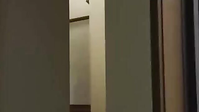 Japanese wife cheating with husband's friend in dim room doorway