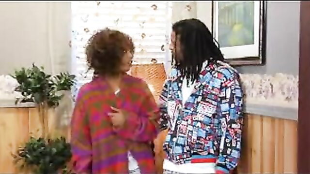 Black couple in 90s outfits flirt intimately in vintage bedroom scene