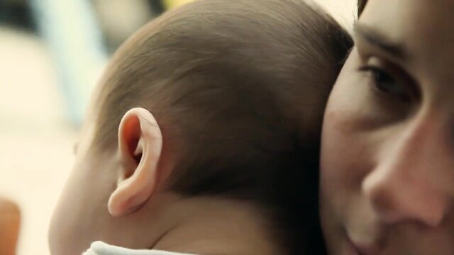 Kirstin Schwab holds topless baby lactation tits closeup Erdbeerlust