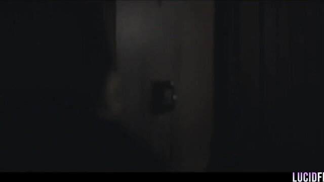 Lilly Bell in dark LUCIDFLIX room, nude tease closeup