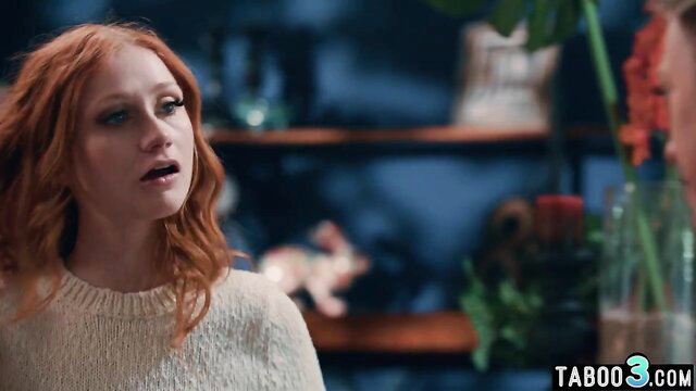 Dee Williams in a blurred indoor scene with a concerned expression