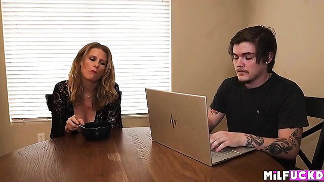 Blonde MILF in lingerie feeds young tattooed guy at table in Mom Likes Young Dick