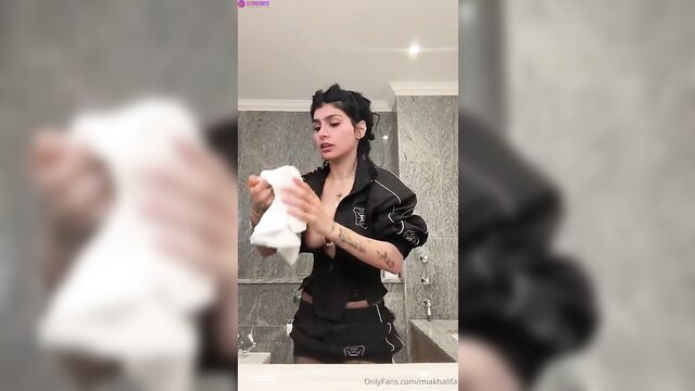 Mia Khalifa in hot black track jacket stripping naked in bathroom