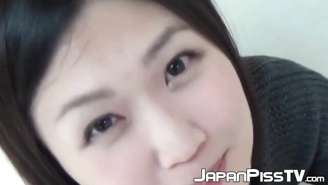 Closeup of cute Japanese woman's face in Piss Japan TV pee video