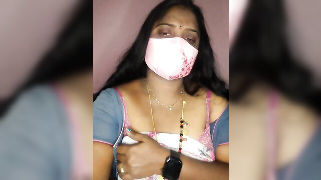 Vani-09 Indian MILF in pink mask and saree blouse, teasing cleavage