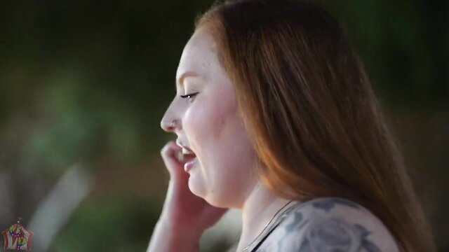 Mia Dior closeup profile, redhead curvy beauty smiling seductively