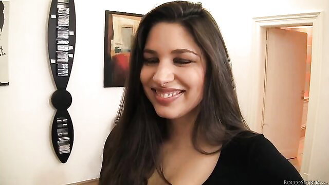 Sexy Zafira smiling seductively in tight top, solo tease