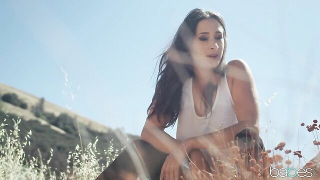 Tempting brunette teen runaway in tight white tank top outdoors