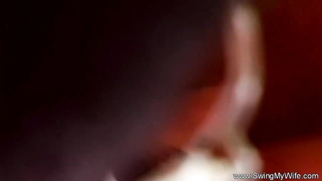Blurry red-lit closeup of hotwife bending over for rough shag