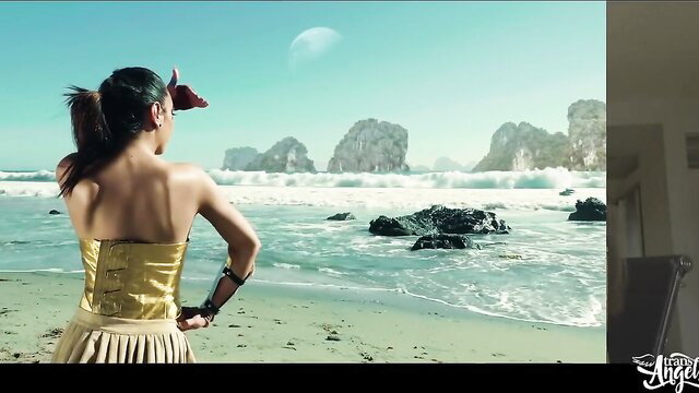 Wonder Woman XXX trans parody BTS: Asian beauty in gold skirt on beach with moon