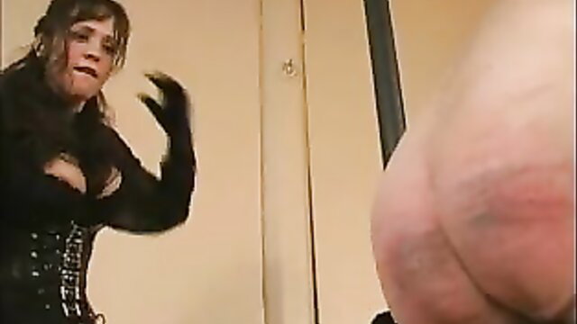 Extreme dominatrix in black corset tortures cock and balls